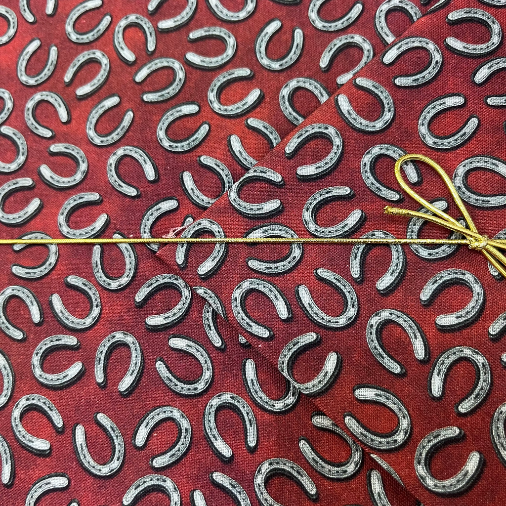 Benartex - Yellowstone - Tossed Horseshoes Brick Red Fabric